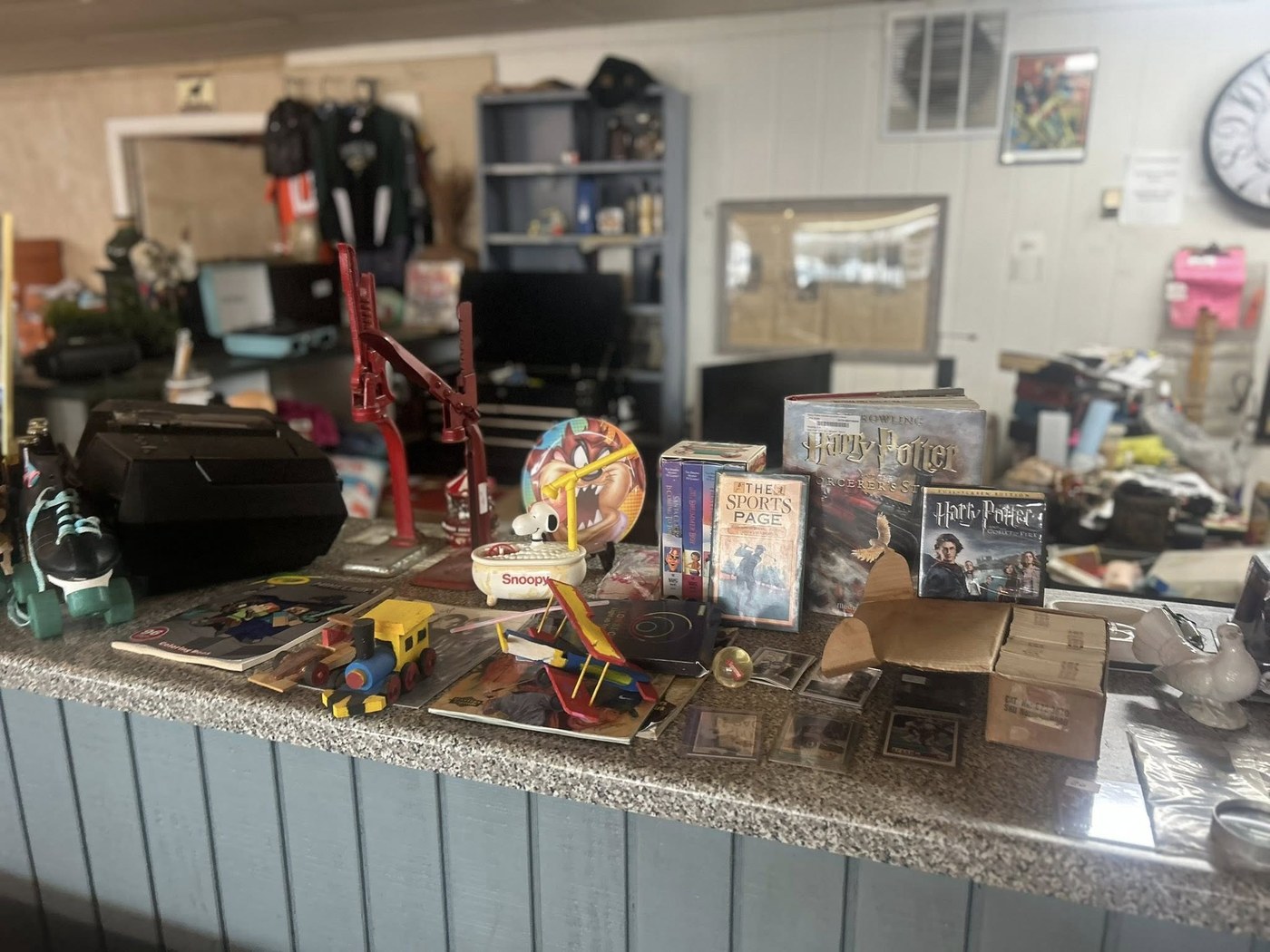Collectibles and books displayed on the shop counter